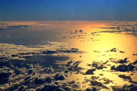 Window seat, a flight in the sunset Stock Photos