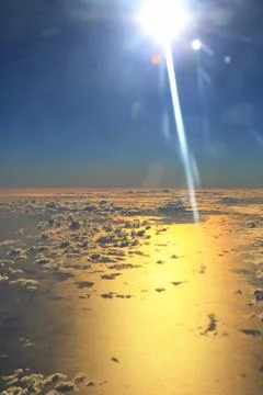 Window seat, a flight in the sunset Stock Photos