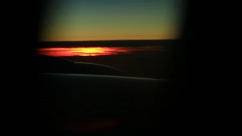 Window seat view of airline jet wing during a golden sunset. Stock-Footage 83654101