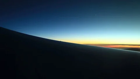 Window seat view of airline jet wing during a golden sunset. 스톡 동영상 83654123