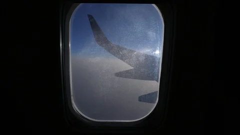 Window Seat View On Airplane In Flight Vídeo Stock 89341475