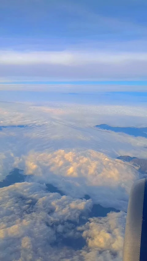 Window seat view - peaceful, reflective mood - passenger gazing out over horizon Stock Footage 320057033