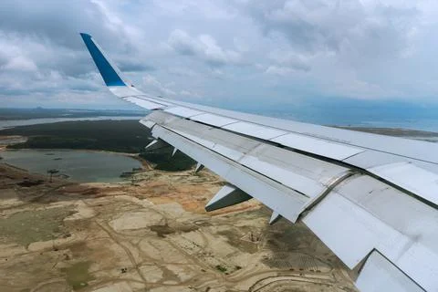 Window Seat View From The Plane Wing Flying Over Singapore Land 스톡 사진