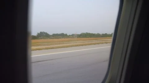 A window seat view of the runway during takeoff from Kos, capturing the ant.. Stock Footage 292753940