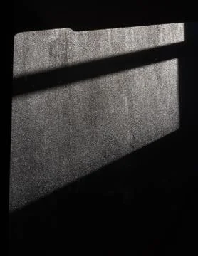 A window shadow on the gray concrete wall Stock Photos