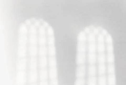 Window shadow overlay on white concrete wall Stock Photos