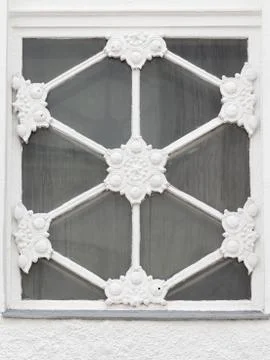 Window in the shape of snowflake Stock Photos