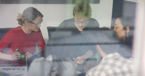 Window shot of students talking about assignment in coworking space Video stock 99934548