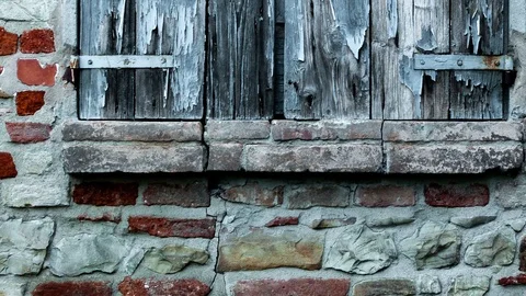 Window shutter of rural house, with brick wall and ancient stones. Stock Footage 112247127