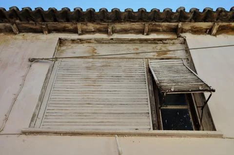 Window shutter stained wall Stock-Fotos