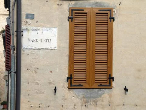 Window with signpost on the wall Stock Photos