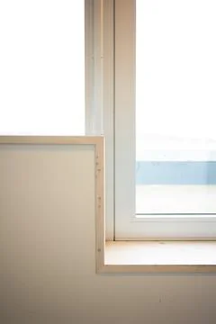 Window sill making a sharp angle by a door Stock Photos