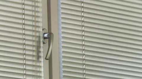 A window with a silver handle and a silver frame Photos