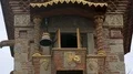 Window at small balcony opening and puppet angel striking bell, clock tower HD Footage