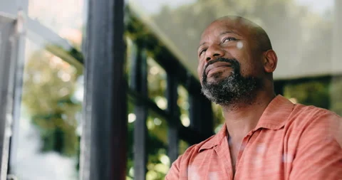 Window, smile and thinking with black man in home for memory, vision or mindset Stock Footage 323277891