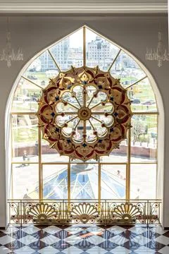 Window with stained glass in empty decorated hall of theater Stock Photos