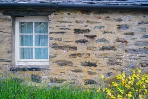 Window in a stone wall Stock Photos