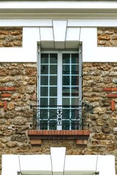 Window on the stone wall. Stock Photos