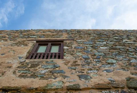 Window on a stone wall Fotos Stock
