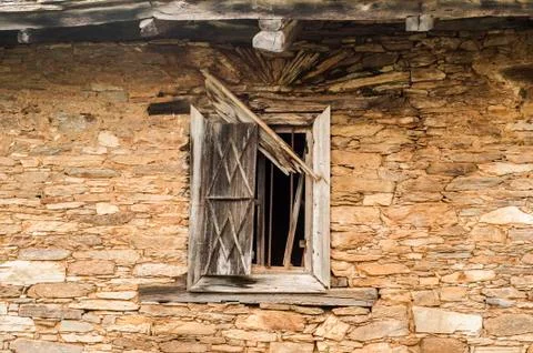 Window on stone wall Stock Photos