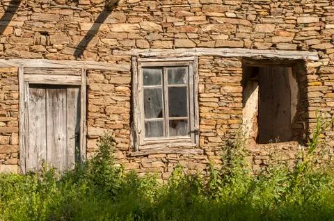 Window on stone wall Stock Photos