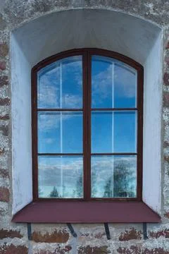 Window on stone wall. Stock Photos