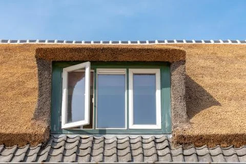 Window with straw roofing Stock Photos