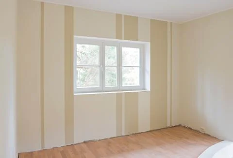 Window on striped wall Фото