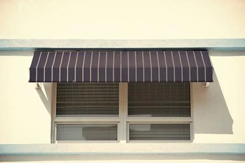 Window sunblind on the building. striped window sunblind. window sunblind Stock Photos