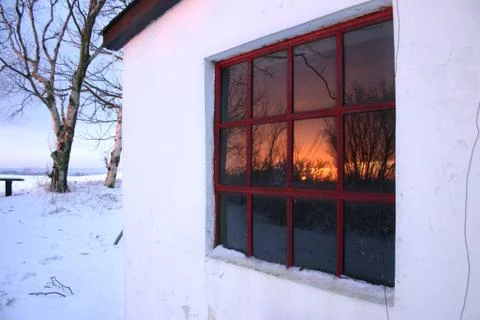 Window in sunset winter Stock Photos