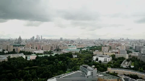 From the window of a tall building you can see a big city on a cloudy day Stock Footage 311444099