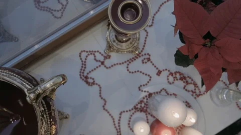 On the window there are candles, beads lie and luminous deers stand. Nearby is a Stock Footage 123585823