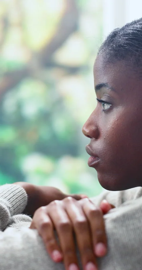 Window, thinking and black woman in home with bad news, reflection or regret for Stock Footage 337462636