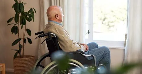 Window, thinking and old man in wheelchair, contemplating and patient in nursing Stock Photos