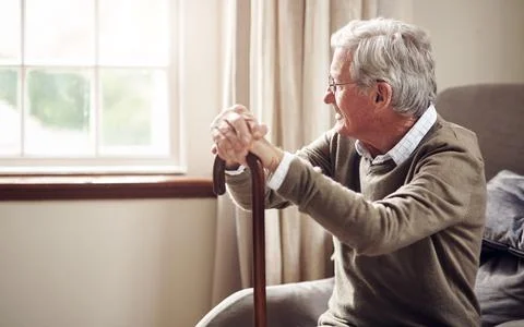 Window, thinking and old man with cane in lounge, retirement and good memor.. Stock Photos