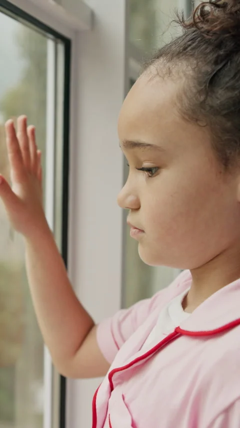 Window, thinking and sad child with depression, neglect or remember memories for Stock Footage 338184757