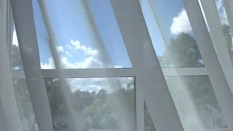 The window through the curtains at the sky. Stock Footage 81346769