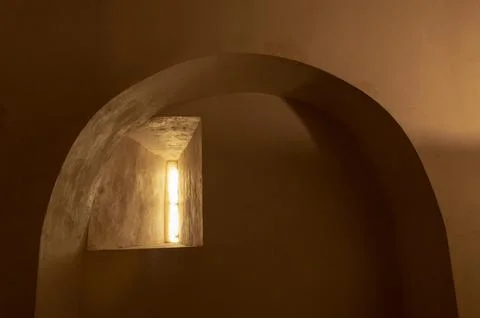 Window through which the light enters the old prison cell of the palace Foto stock