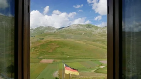 Window timelapse clouds and german flag Stock Footage 65801083