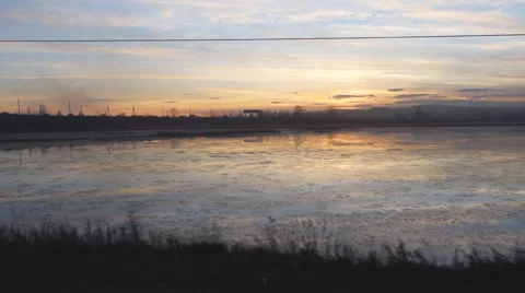 From the window of a train on the Lake at sunset Stock Footage 59171711
