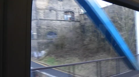 From the window of a train, out of tunnel, crosses River Tyne towards Newcastle, Stock Footage 1099671