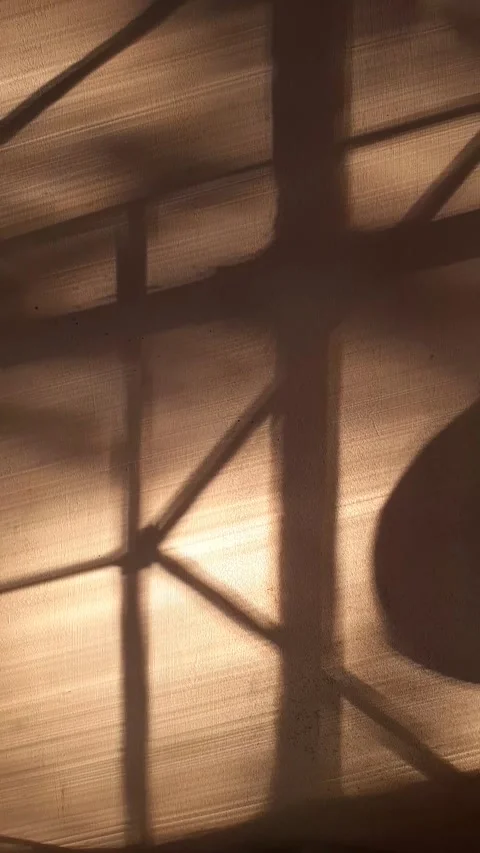 Window trellis shadow on white wall at sunset Stock Footage 312855064