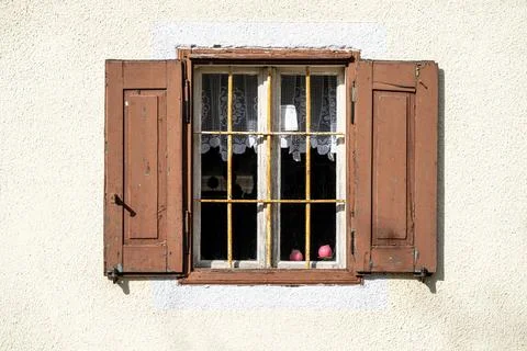 Window with two pink candles. Photos