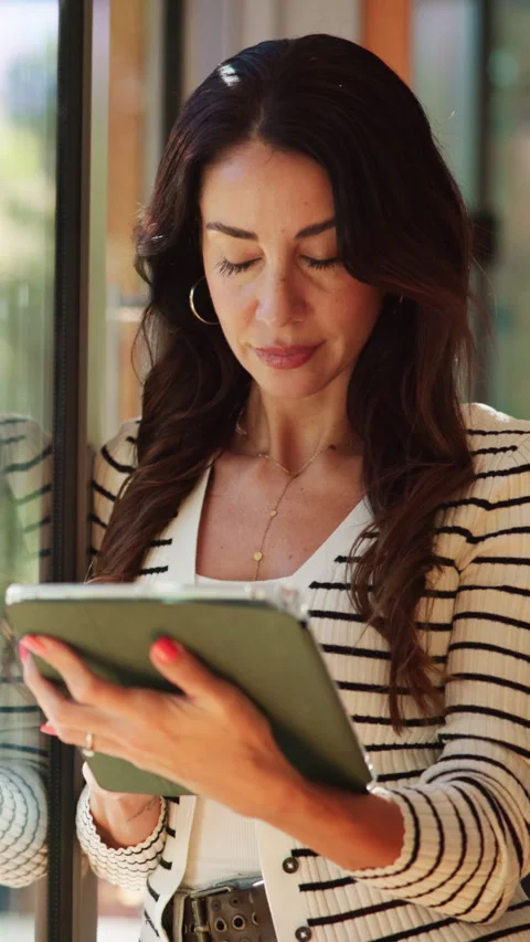 Window, typing and woman on tablet for remote work with online article Stock Footage 333683349