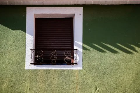 Window under the shade of an eave in the old town of Villajoyosa Stock-Fotos