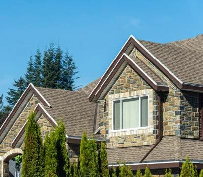 Window on upper level of residential building on skay background Fotos de archivo