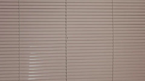 Window venetian blinds slowly closing creating a moving background. Sun Stock Footage 346316482