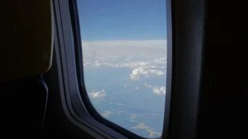 Window view above the clouds from airplane Stock Footage 86097296