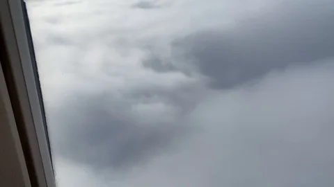 Window view from airplane flying in clouds and fog Stock Footage 119756632