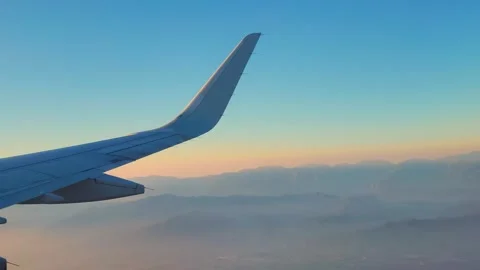 Window View From An Airplane Looking At California during sunset Stock Footage 320073669